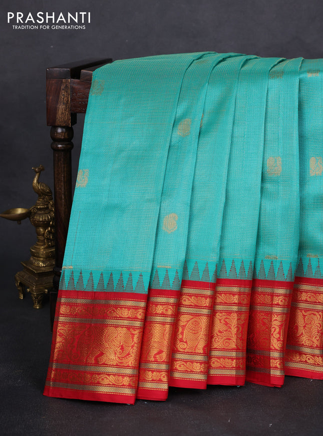 Kuppadam silk cotton saree teal green and red with allover zari weaves & buttas with temple design zari woven border