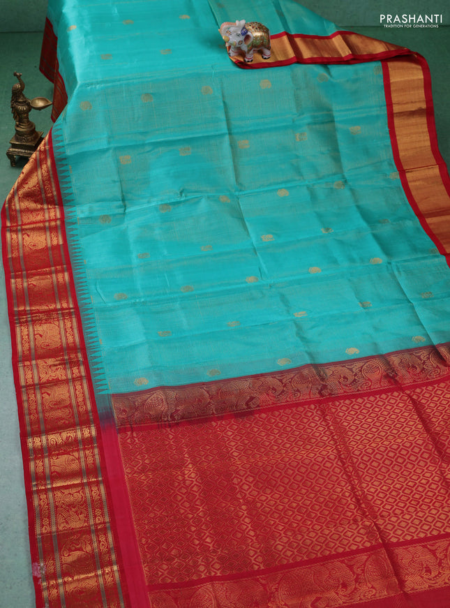 Kuppadam silk cotton saree teal green and red with allover zari weaves & buttas with temple design zari woven border