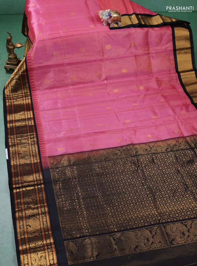 Kuppadam silk cotton saree peach pink and black with allover zari weaves & buttas with temple design zari woven border