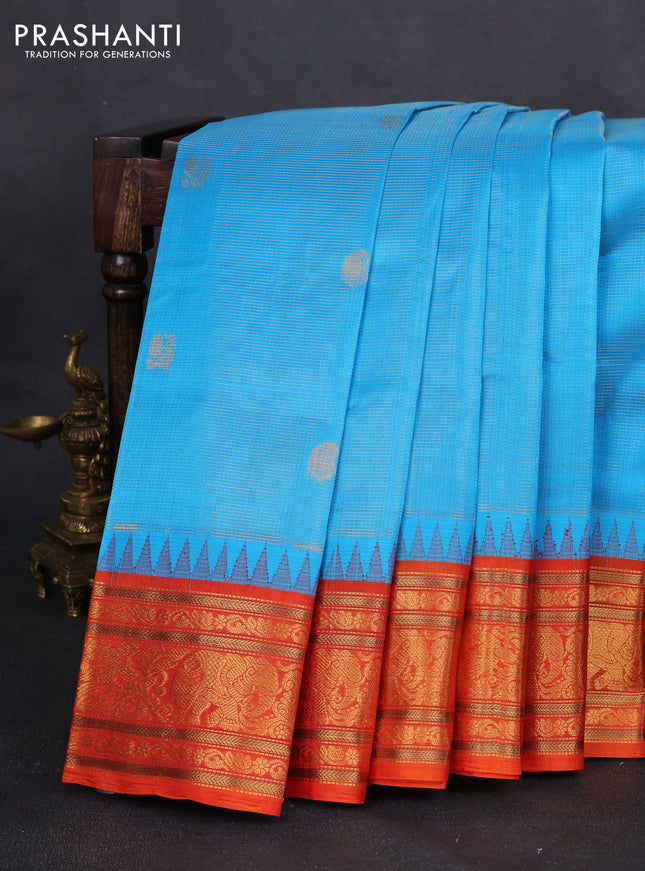 Kuppadam silk cotton saree cs blue and orange with allover zari weaves & buttas with temple design zari woven border