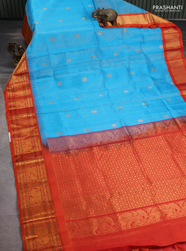 Kuppadam silk cotton saree cs blue and orange with allover zari weaves & buttas with temple design zari woven border