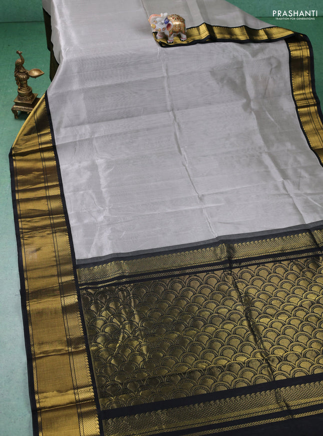 Kuppadam silk cotton saree grey and black with plain body and zari woven border