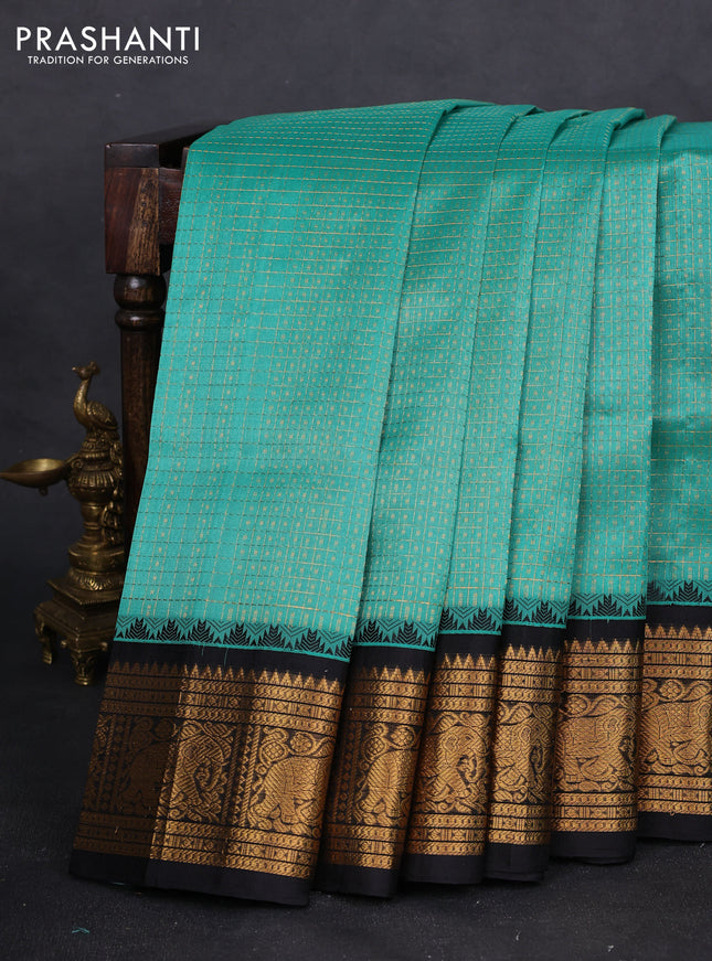 Kuppadam silk cotton saree teal green and black with allover zari checks & lakshadeepam weaves and zari woven border