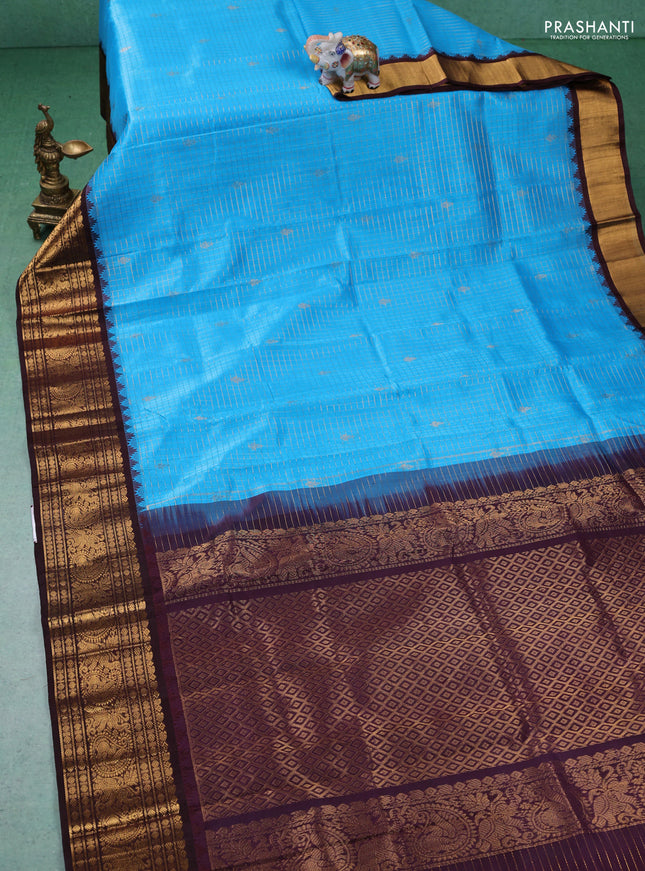 Kuppadam silk cotton saree cs blue and wine shade with allover zari checked pattern and zari woven border