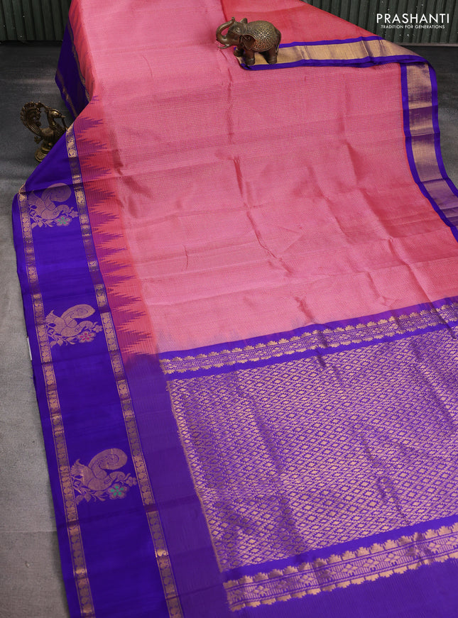 Kuppadam silk cotton saree peach pink and blue with allover small checked pattern and temple design zari annam butta border