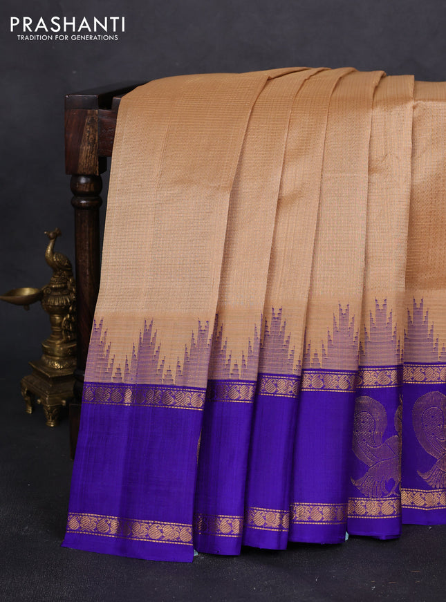Kuppadam silk cotton saree sandal and blue with allover small checked pattern and temple design zari annam butta border