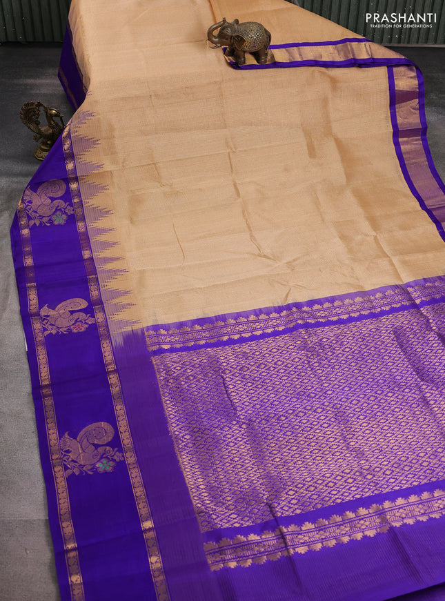 Kuppadam silk cotton saree sandal and blue with allover small checked pattern and temple design zari annam butta border