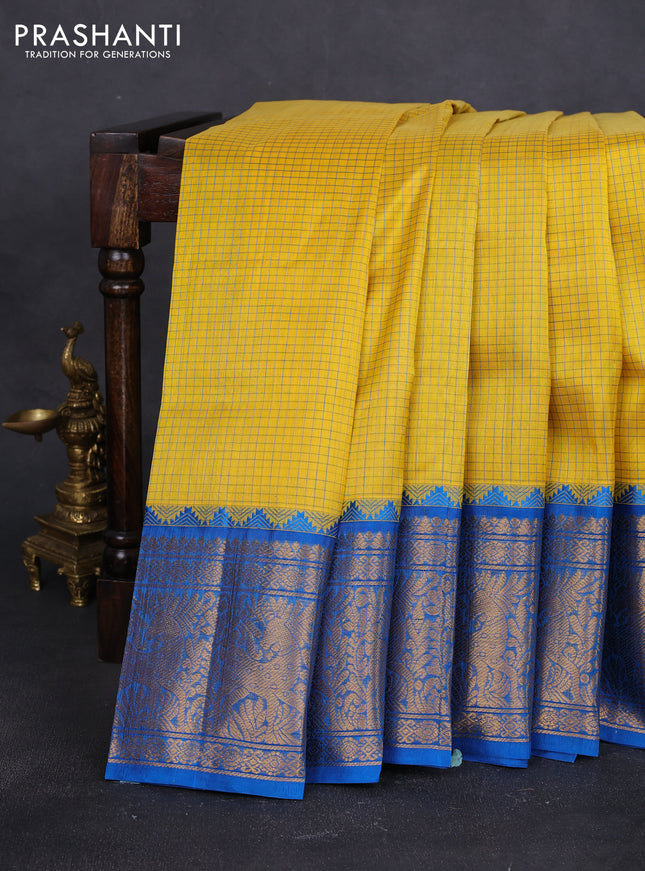 Kuppadam silk cotton saree yellow and cs blue with allover small checked pattern and long zari woven border