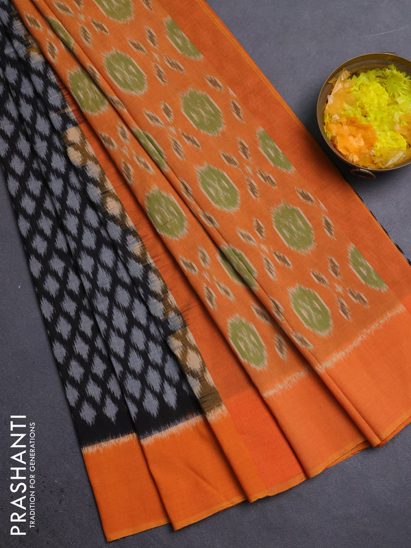 Ikat cotton saree black and orange with allover ikat weaves and simple border
