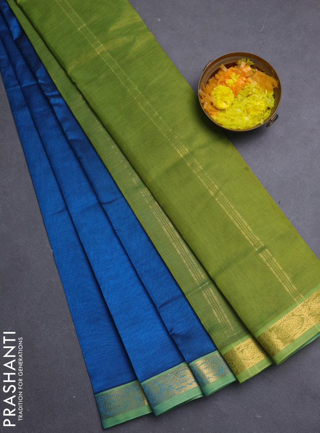 Silk cotton saree peacock blue and light green with plain body and paisley zari woven border