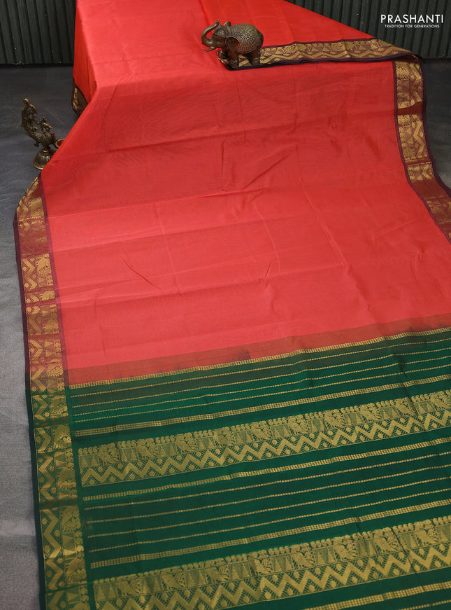 Silk cotton saree orange and green with plain body and annam zari woven border