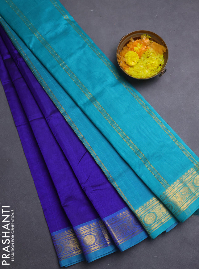 Silk cotton saree blue and teal blue with plain body and annam & rudraksha zari woven border