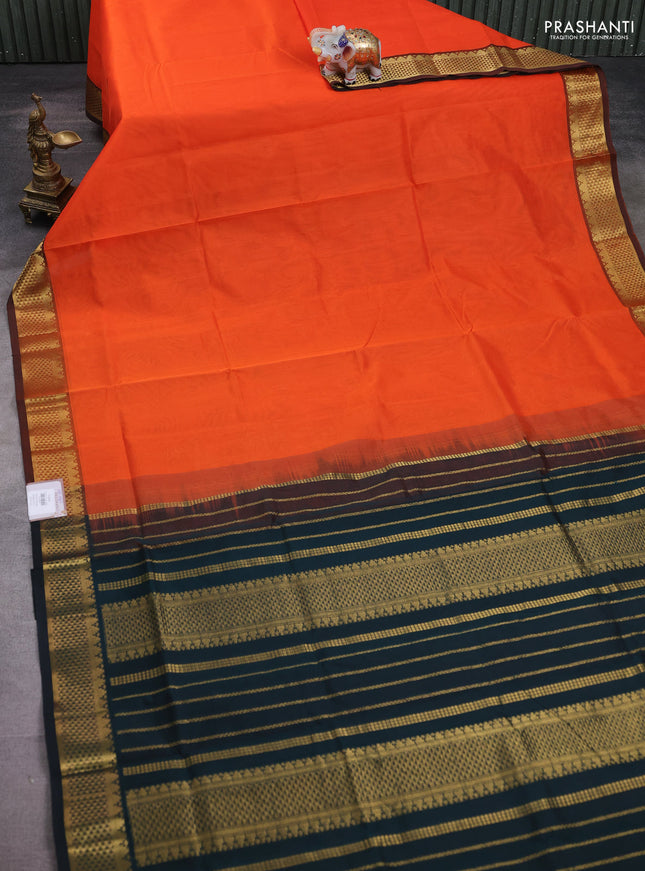 Silk cotton saree orange and bottle green with plain body and temple zari woven border