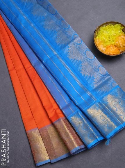 Silk cotton saree orange and teal blue with plain body and temple zari woven border