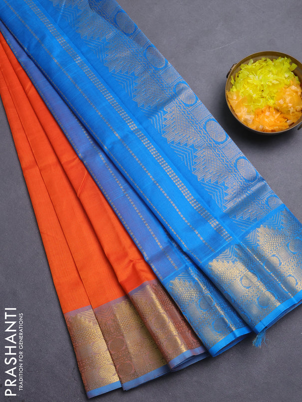 Silk cotton saree orange and teal blue with plain body and temple zari woven border
