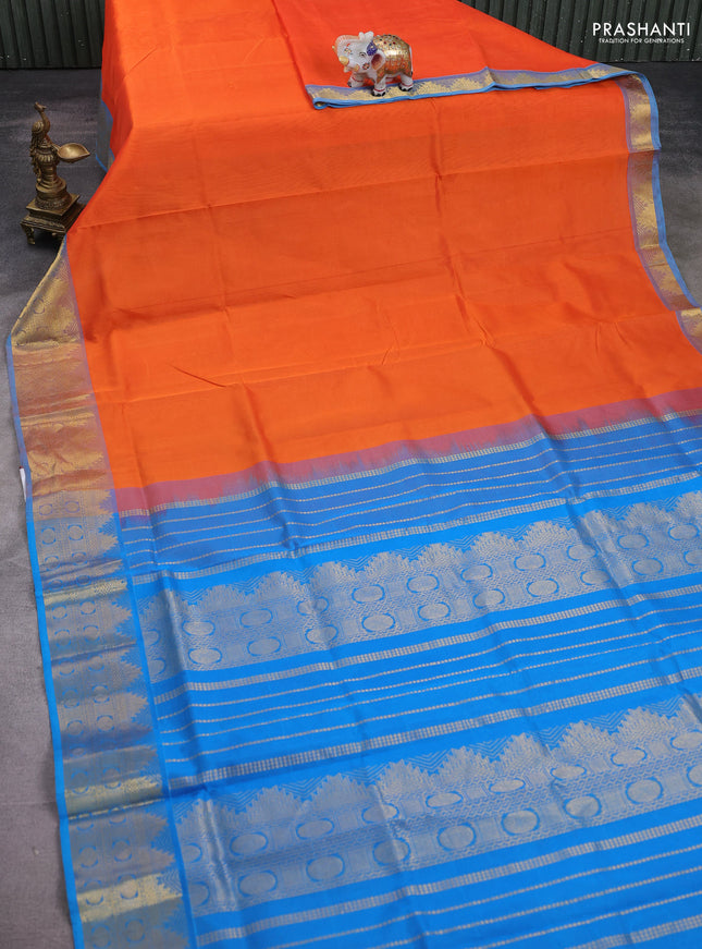 Silk cotton saree orange and teal blue with plain body and temple zari woven border