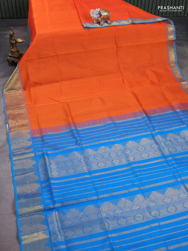 Silk cotton saree orange and teal blue with plain body and temple zari woven border