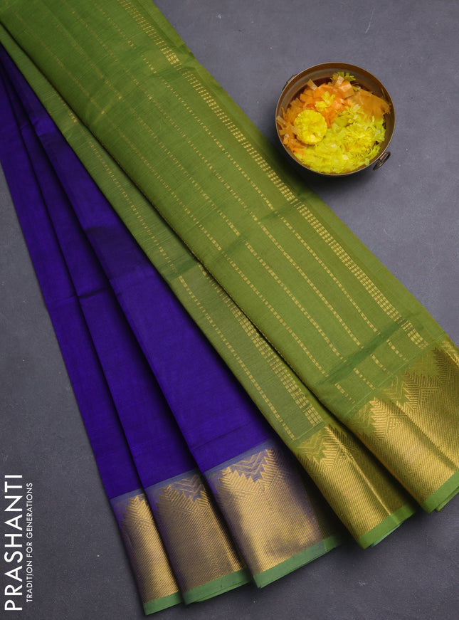 Silk cotton saree blue and light green with plain body and temple zari woven border