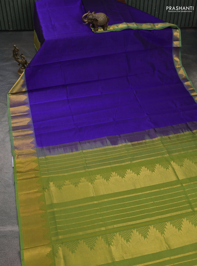 Silk cotton saree blue and light green with plain body and temple zari woven border
