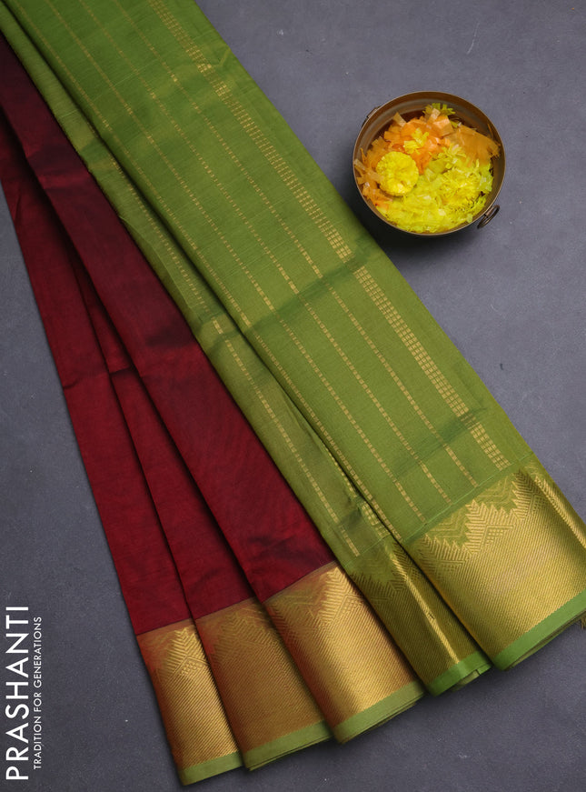 Silk cotton saree deep maroon and light green with plain body and temple zari woven border