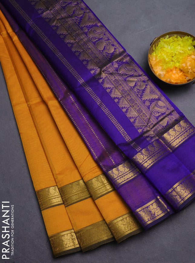 Silk cotton saree yellow and blue with plain body and retttapet zari woven border