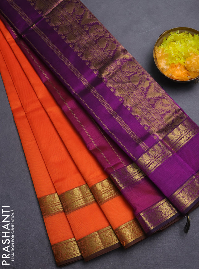 Silk cotton saree orange and purple with plain body and retttapet zari woven border