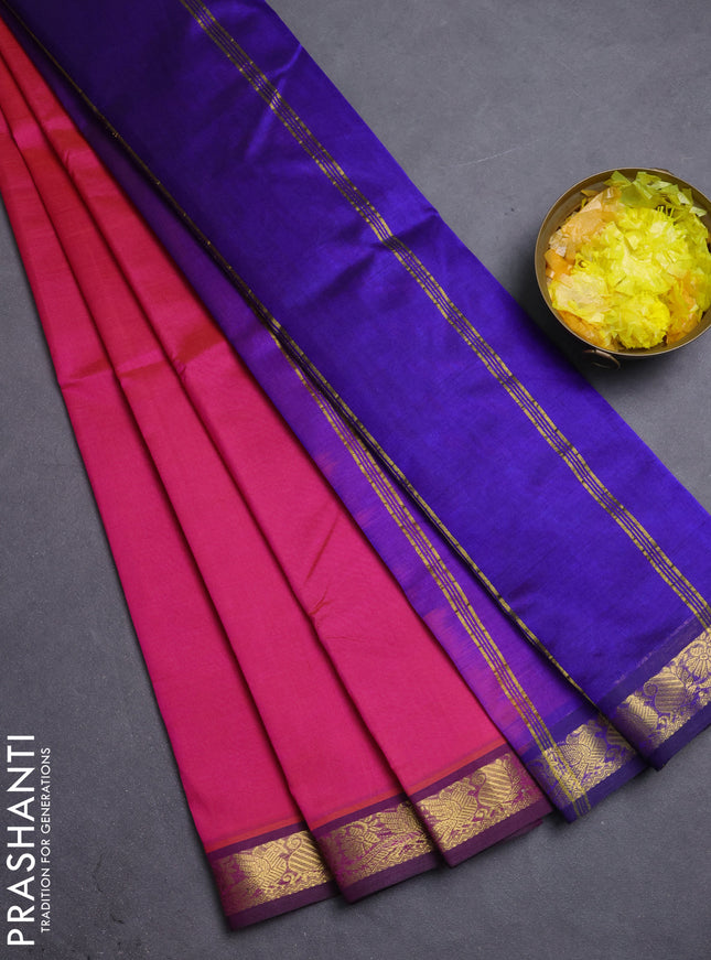 Silk cotton saree dual shade of pinkish orange and violet with plain body and zari woven border