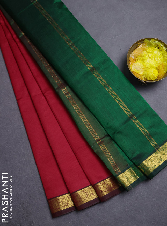 Silk cotton saree red and green with plain body and zari woven border