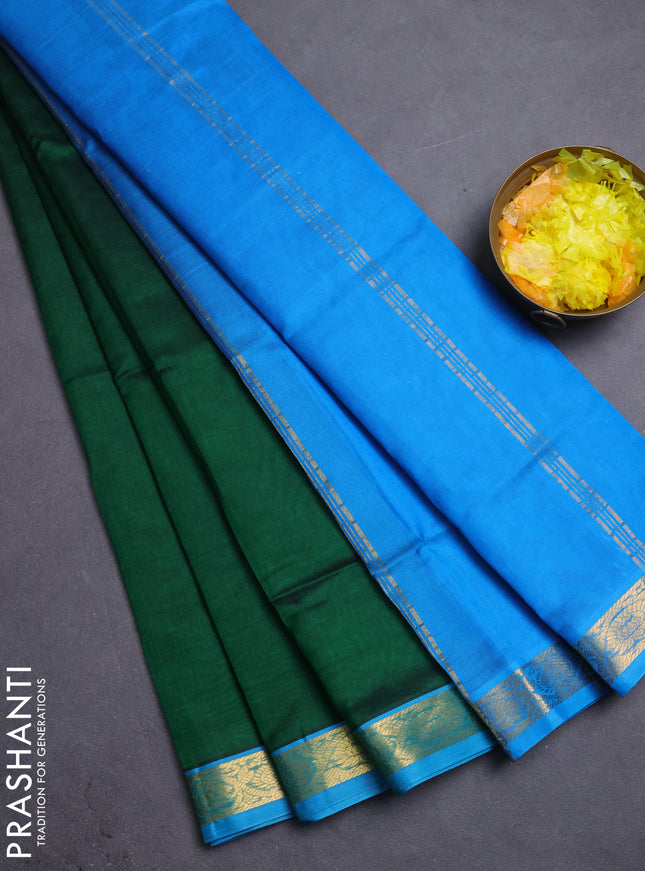 Silk cotton saree green and blue with plain body and zari woven border