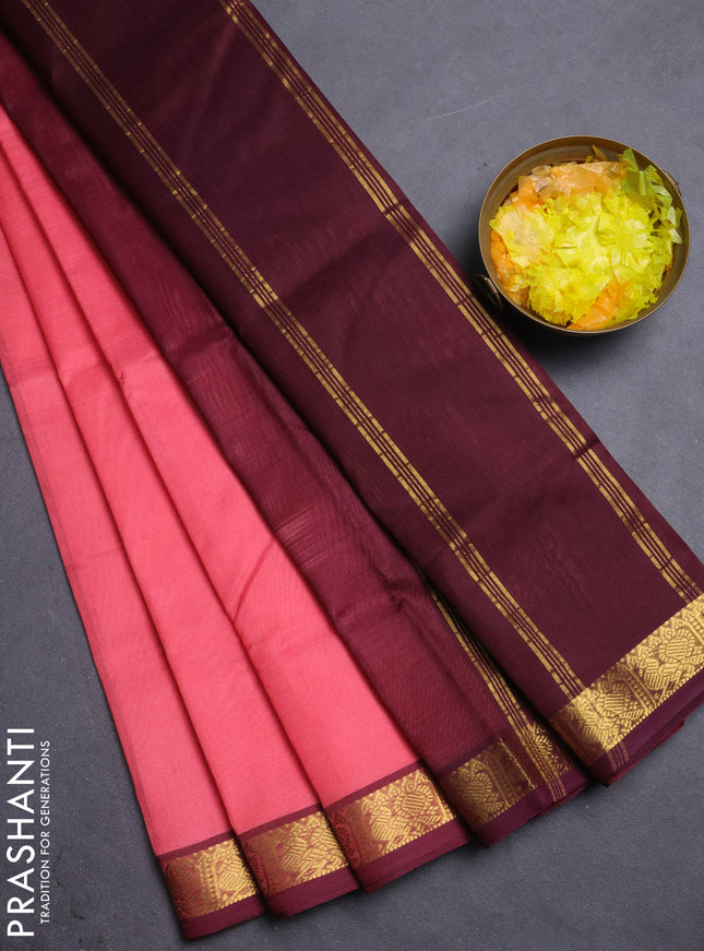 Silk cotton saree peach shade and coffee brown with plain body and annam zari woven border