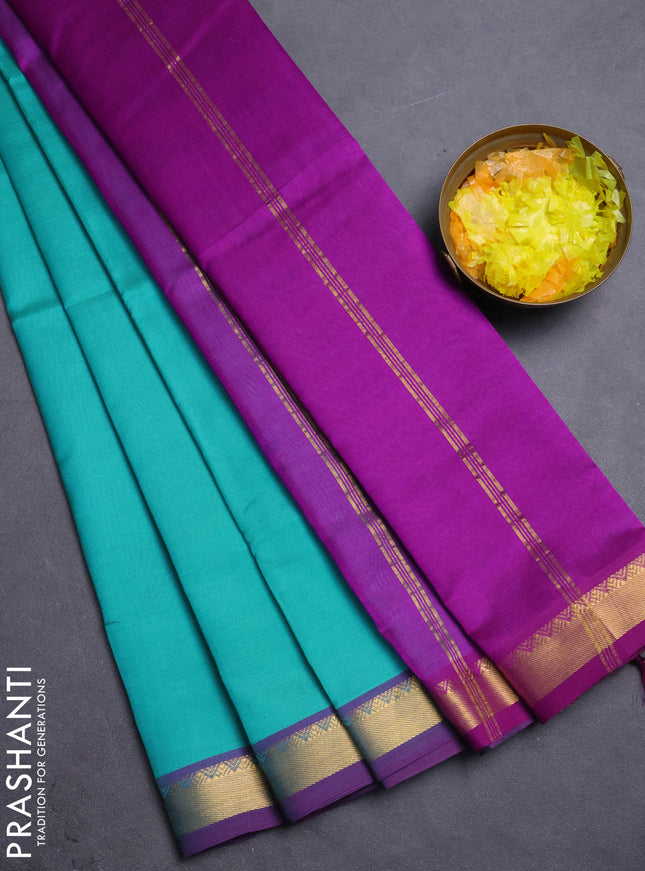 Silk cotton saree teal blue and purple with plain body and zari woven border