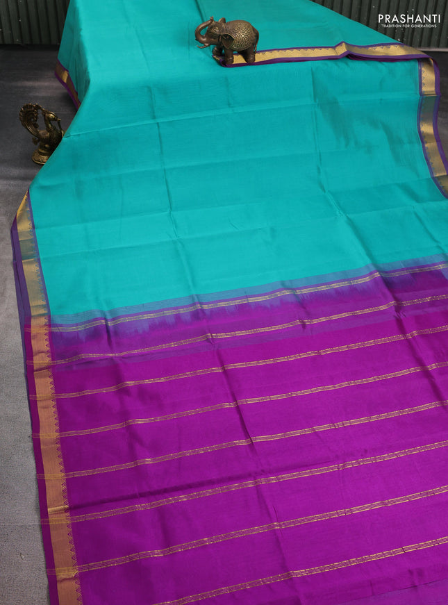 Silk cotton saree teal blue and purple with plain body and zari woven border