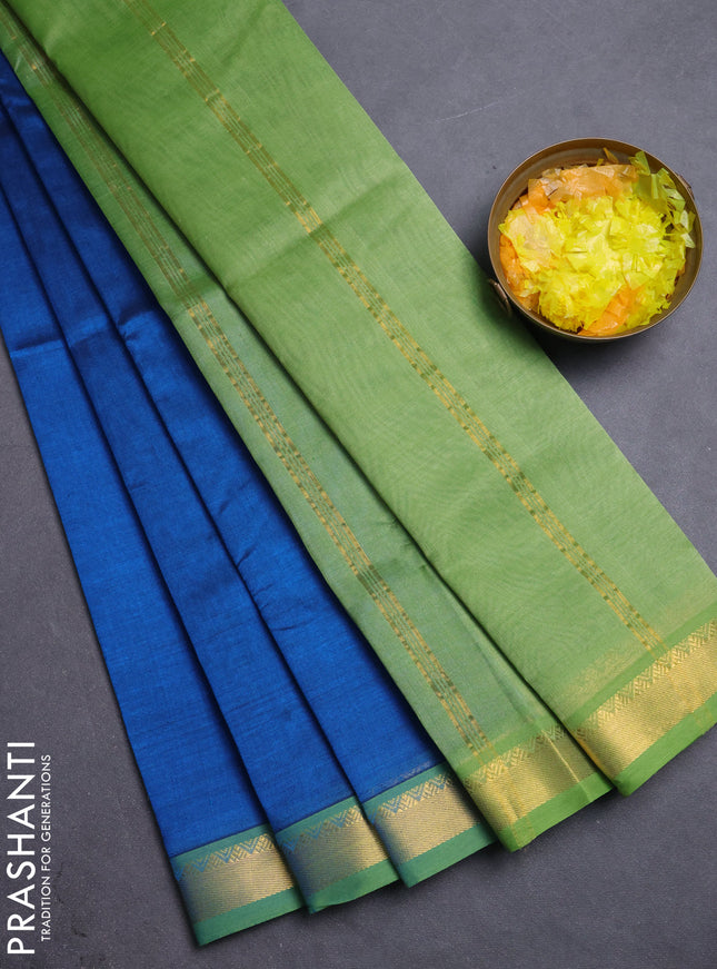 Silk cotton saree peacock blue and pastel green with plain body and zari woven border