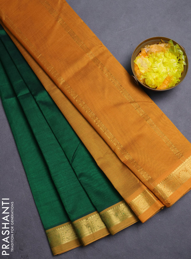 Silk cotton saree green and dark mustard with plain body and zari woven border