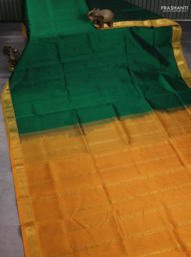 Silk cotton saree green and dark mustard with plain body and zari woven border