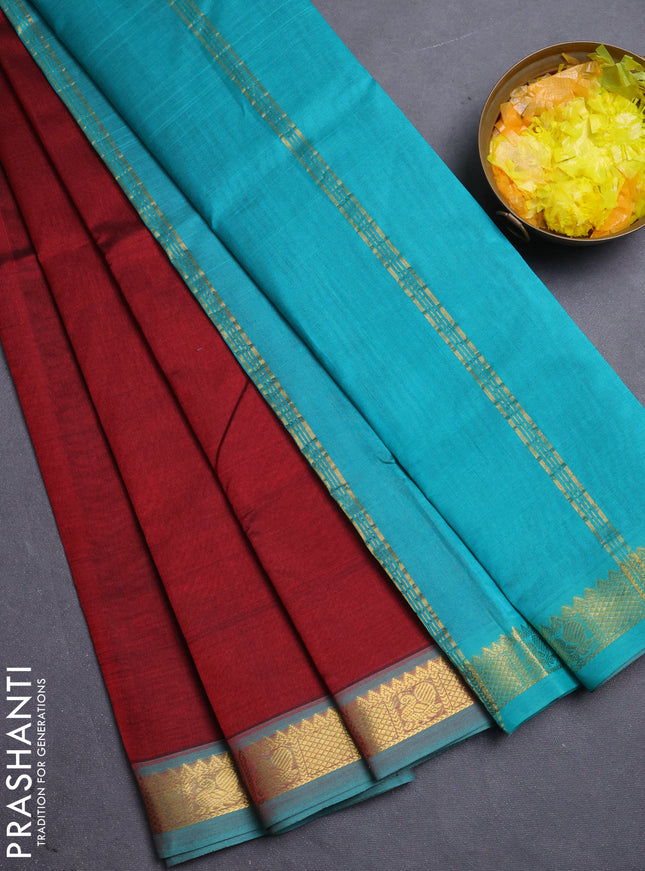 Silk cotton saree maroon and teal green with plain body and zari woven border