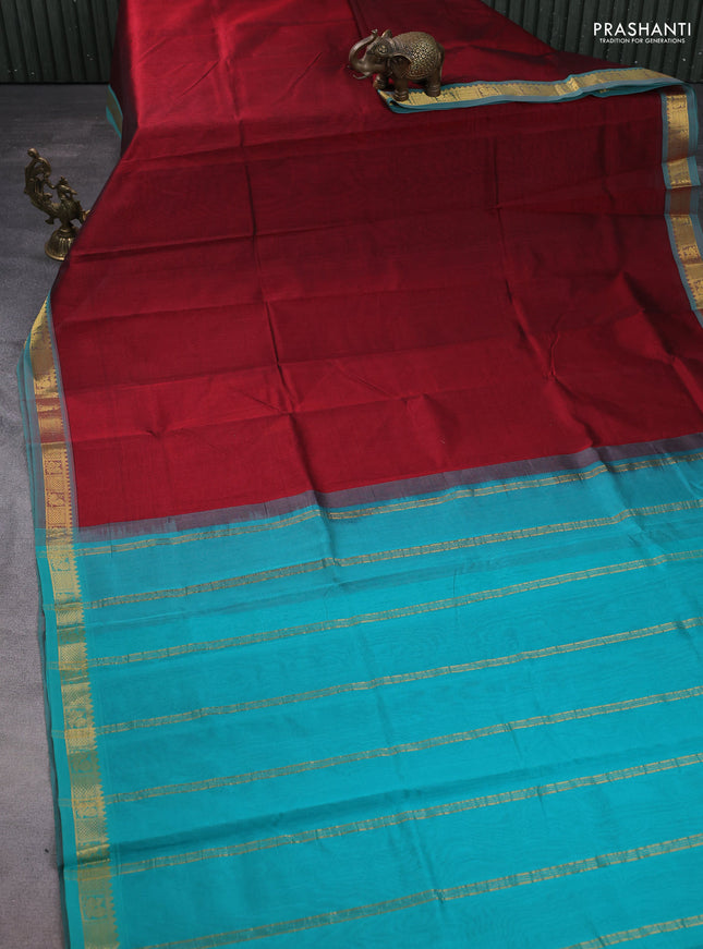 Silk cotton saree maroon and teal green with plain body and zari woven border