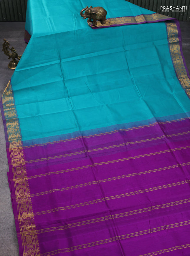 Silk cotton saree teal blue and purple with plain body and peacock zari woven border
