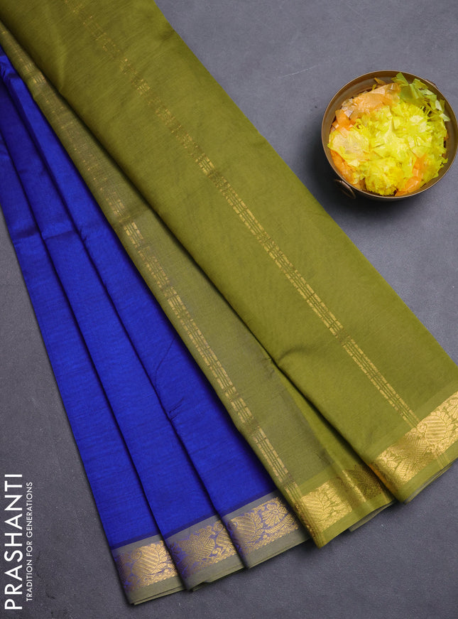 Silk cotton saree blue and sap green with plain body and peacock zari woven border