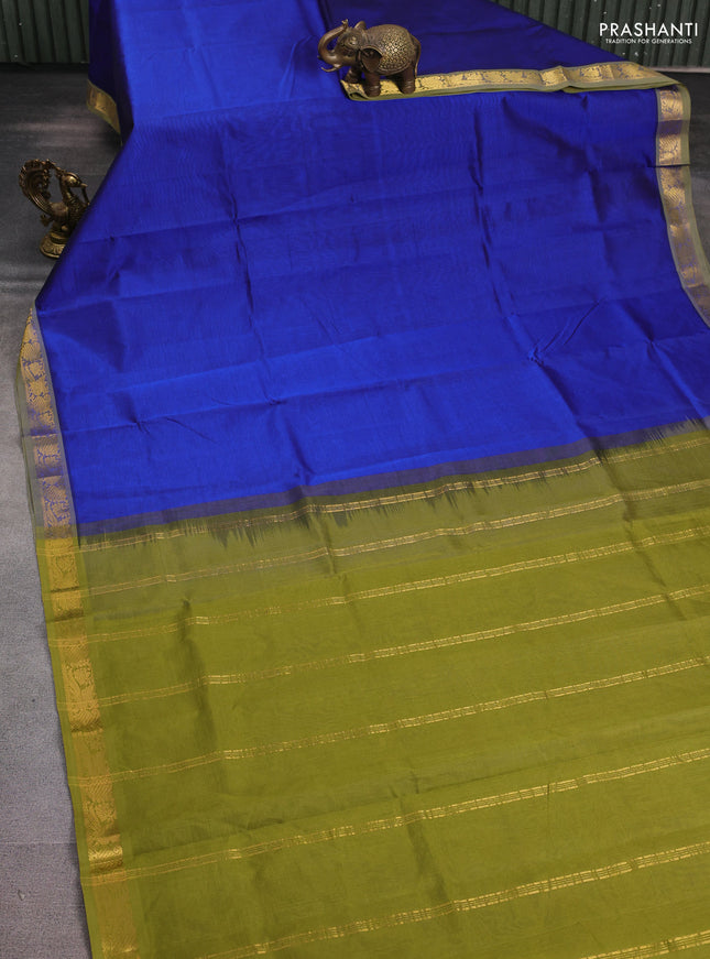Silk cotton saree blue and sap green with plain body and peacock zari woven border
