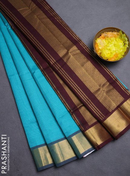 Silk cotton saree teal blue and coffee brown with plain body and zari woven border