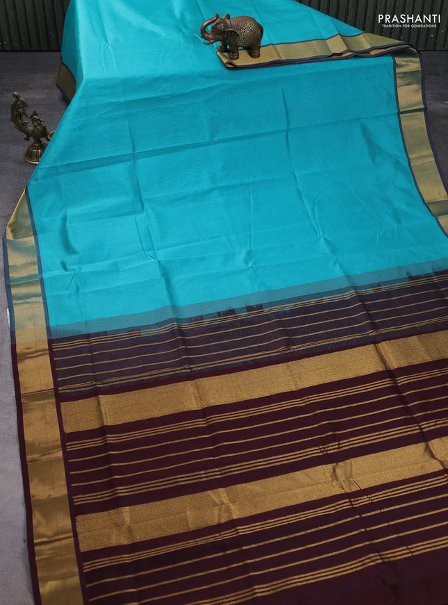 Silk cotton saree teal blue and coffee brown with plain body and zari woven border