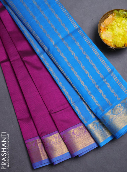 Silk cotton saree purple and cs blue with plain body and zari woven border