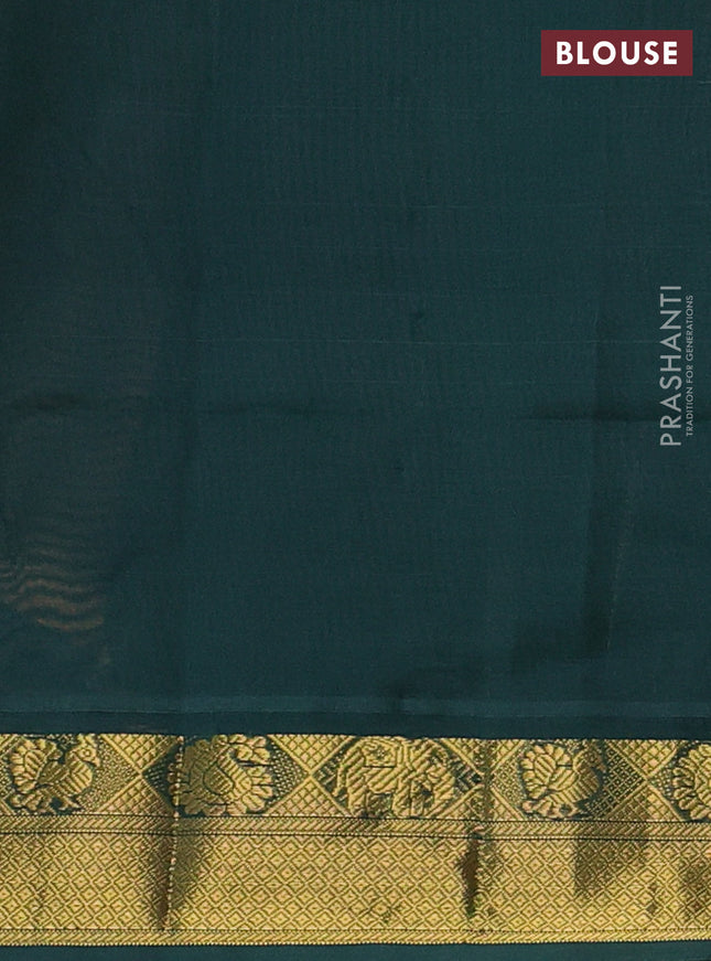 Silk cotton saree pale orange and bottle green with plain body and zari woven border