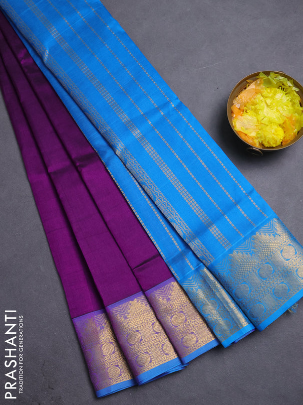 Silk cotton saree purple and cs blue with plain body and zari woven border