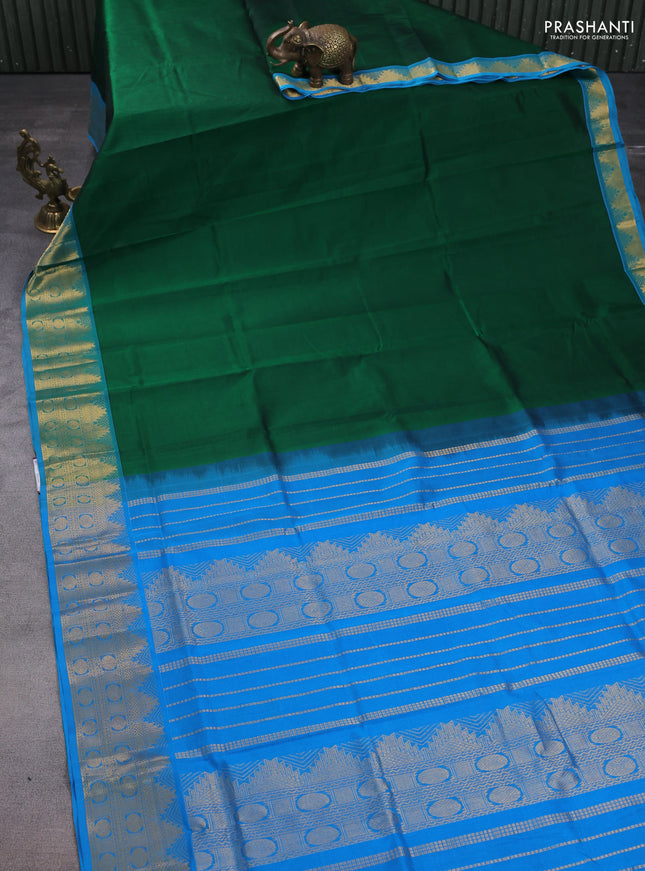 Silk cotton saree green and cs blue with plain body and zari woven border