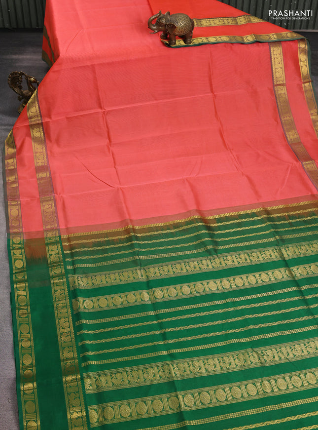 Silk cotton saree dark peach and green with plain body and rettapet zari woven border