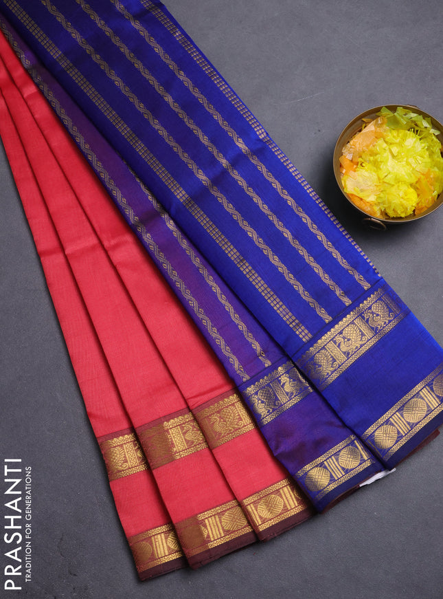 Silk cotton saree dark peach pink and blue with plain body and rettapet zari woven border
