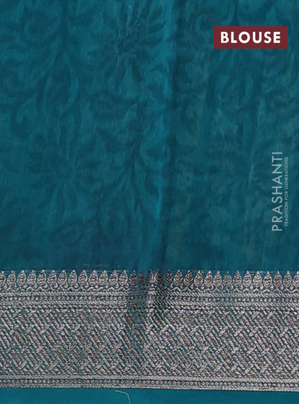 Chanderi silk cotton saree teal green with allover prints and banarasi style border