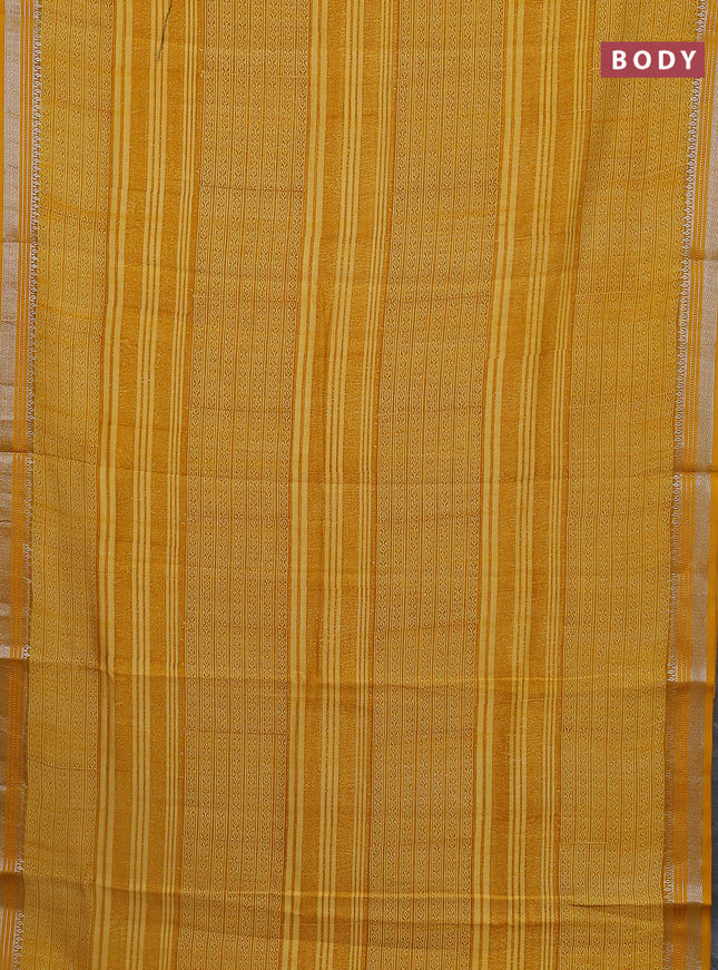 Chanderi silk cotton saree mustard yellow with allover prints and silver zari woven border